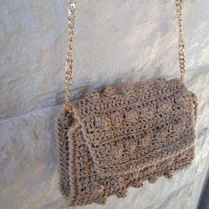 Tan hand-crocheted raffia purse